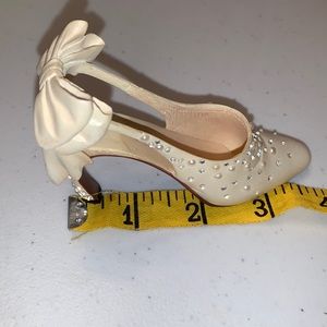 Just the Right Shoe miniature shoes. One is I Do and the other is Forever Yours.